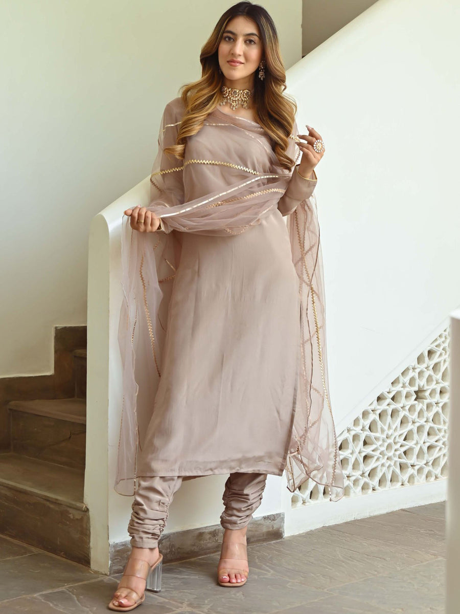 Beige silk kurta set with hand and machine work main image 1